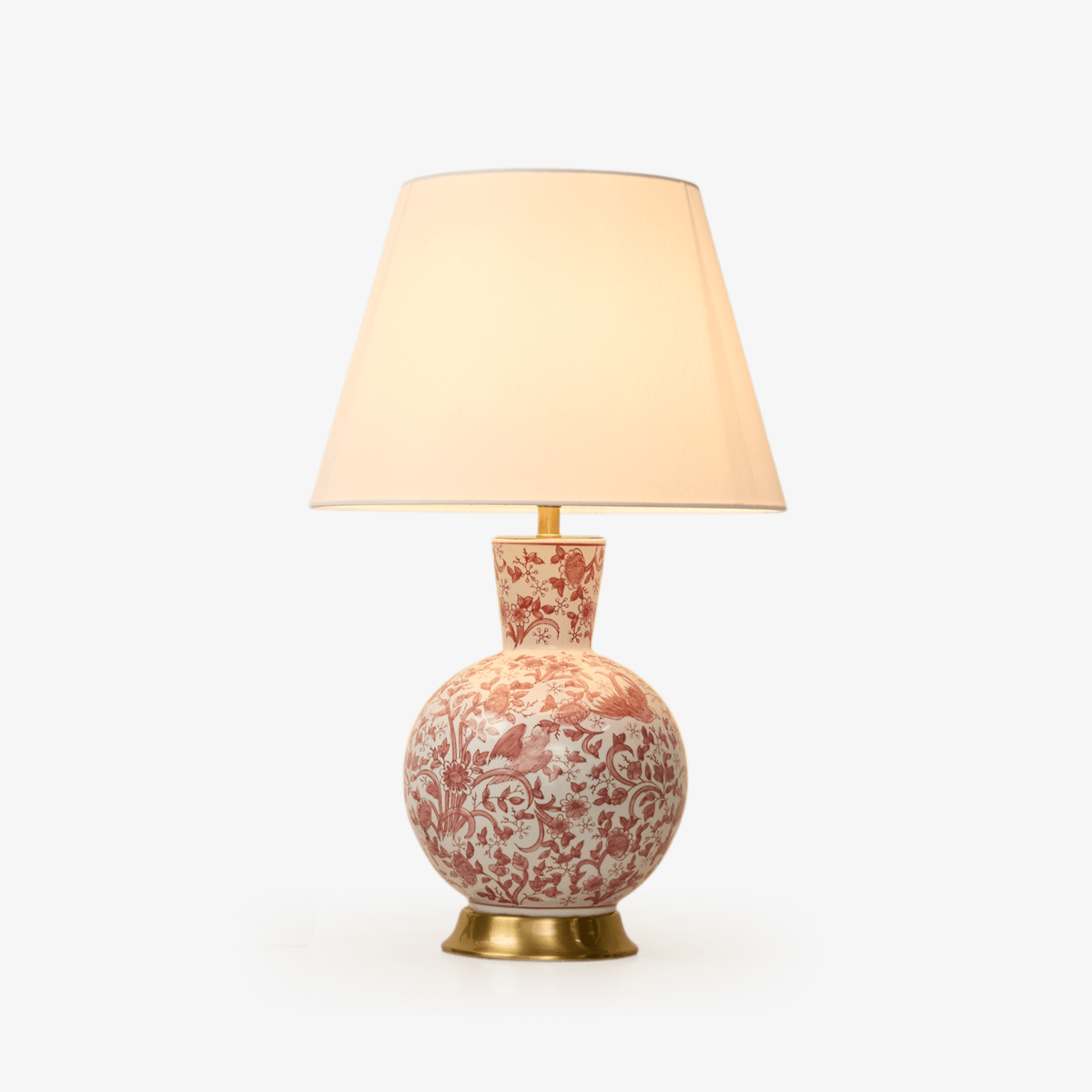 Korallfärgad keramisk bordslampa med fågel och blommor