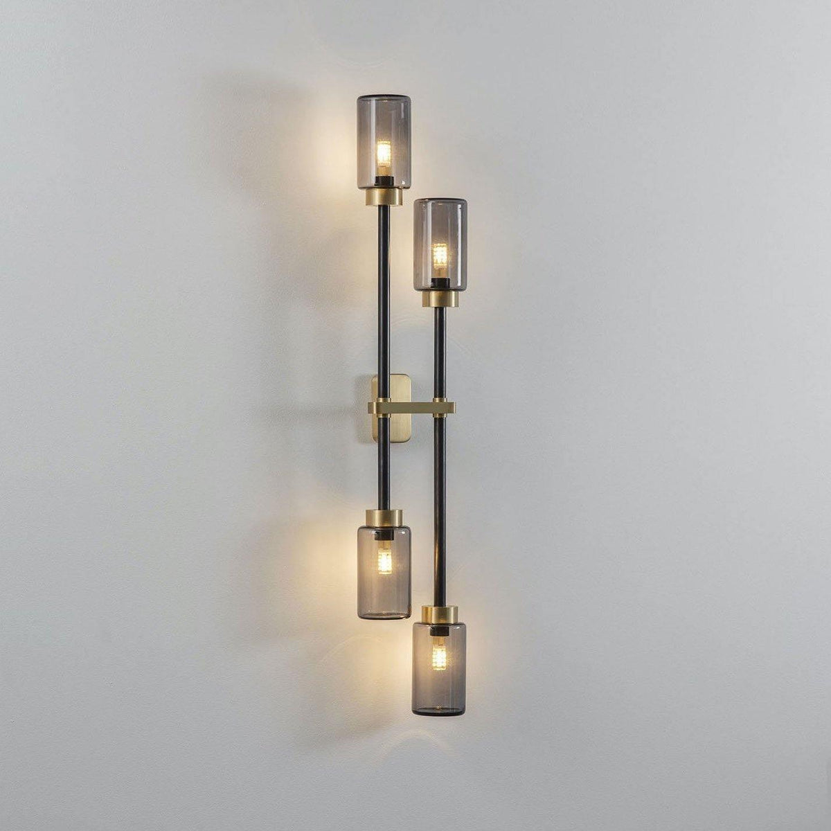 Tekas linjär vägglampa med cylindrar i glas