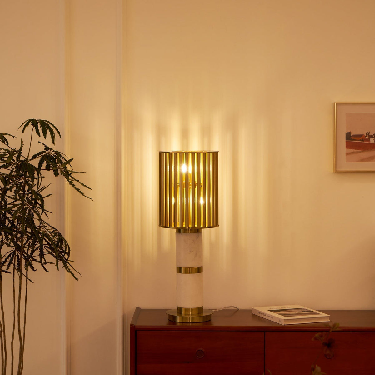 Elios Forgyldt bordlampe med burdesign