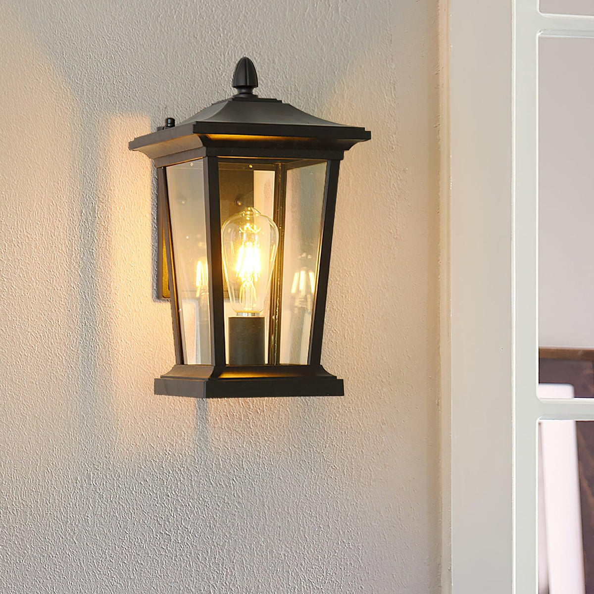 Edwin elegant utomhusvägglampa i fågelbursstil med glas