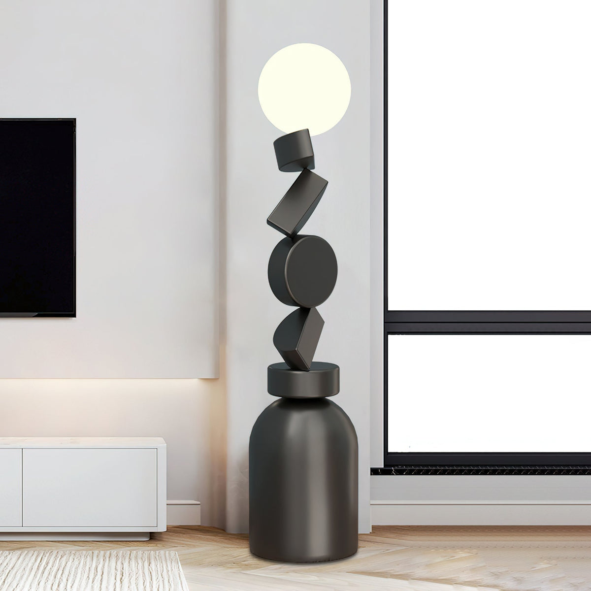 Calisine-gulvlampe med monolitisk kubeformet sort fod