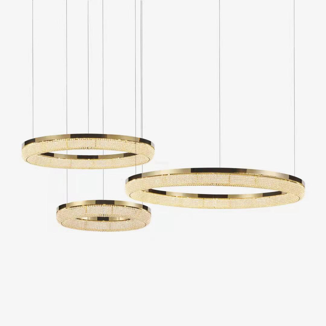 Cyrereon rund kristallampa i guld med LED