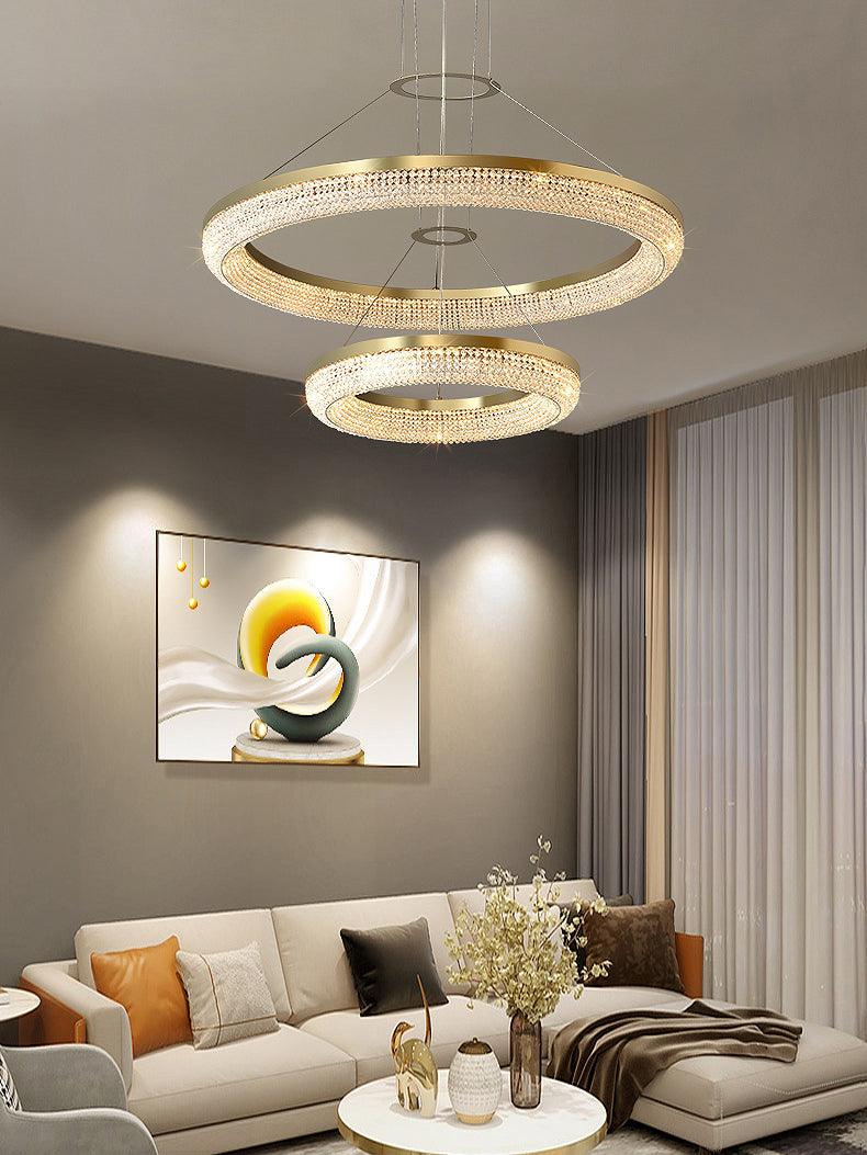 Cyrereon rund kristallampa i guld med LED