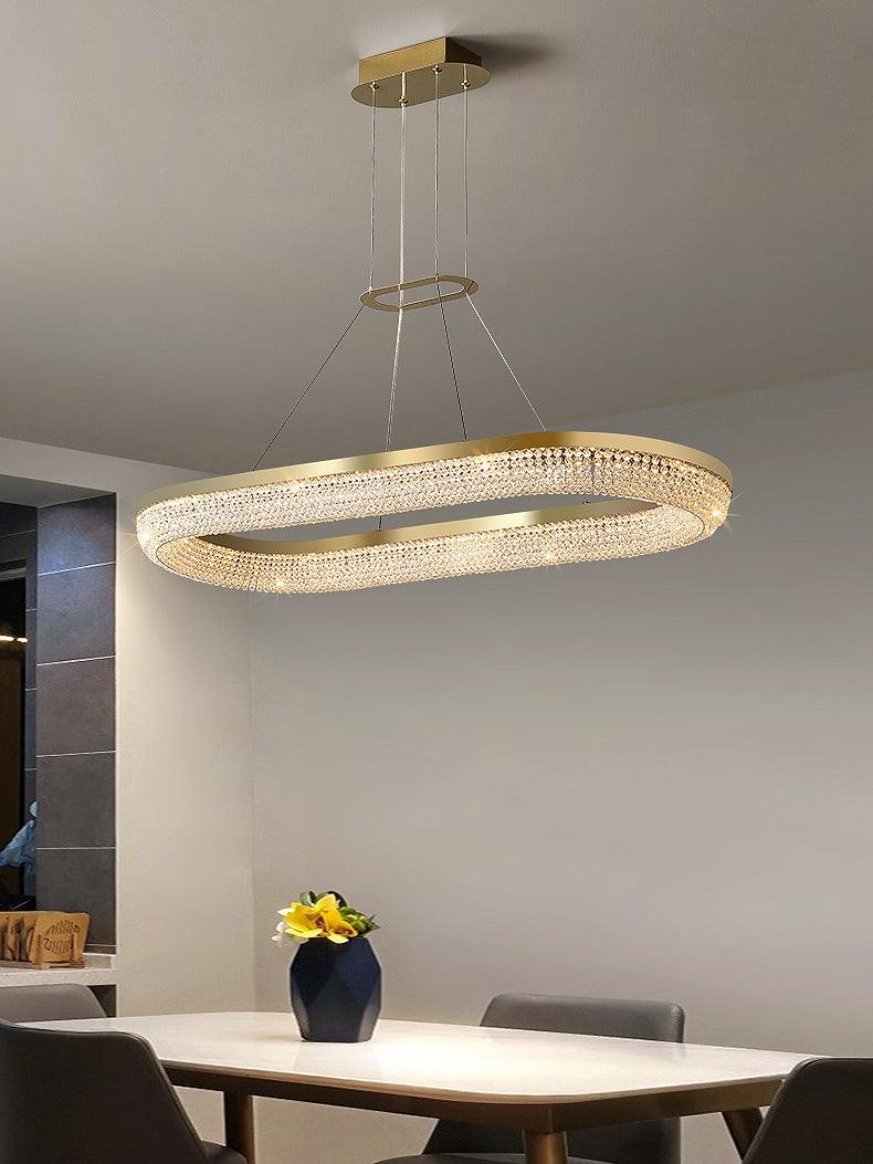 Cyrereon rund kristallampa i guld med LED