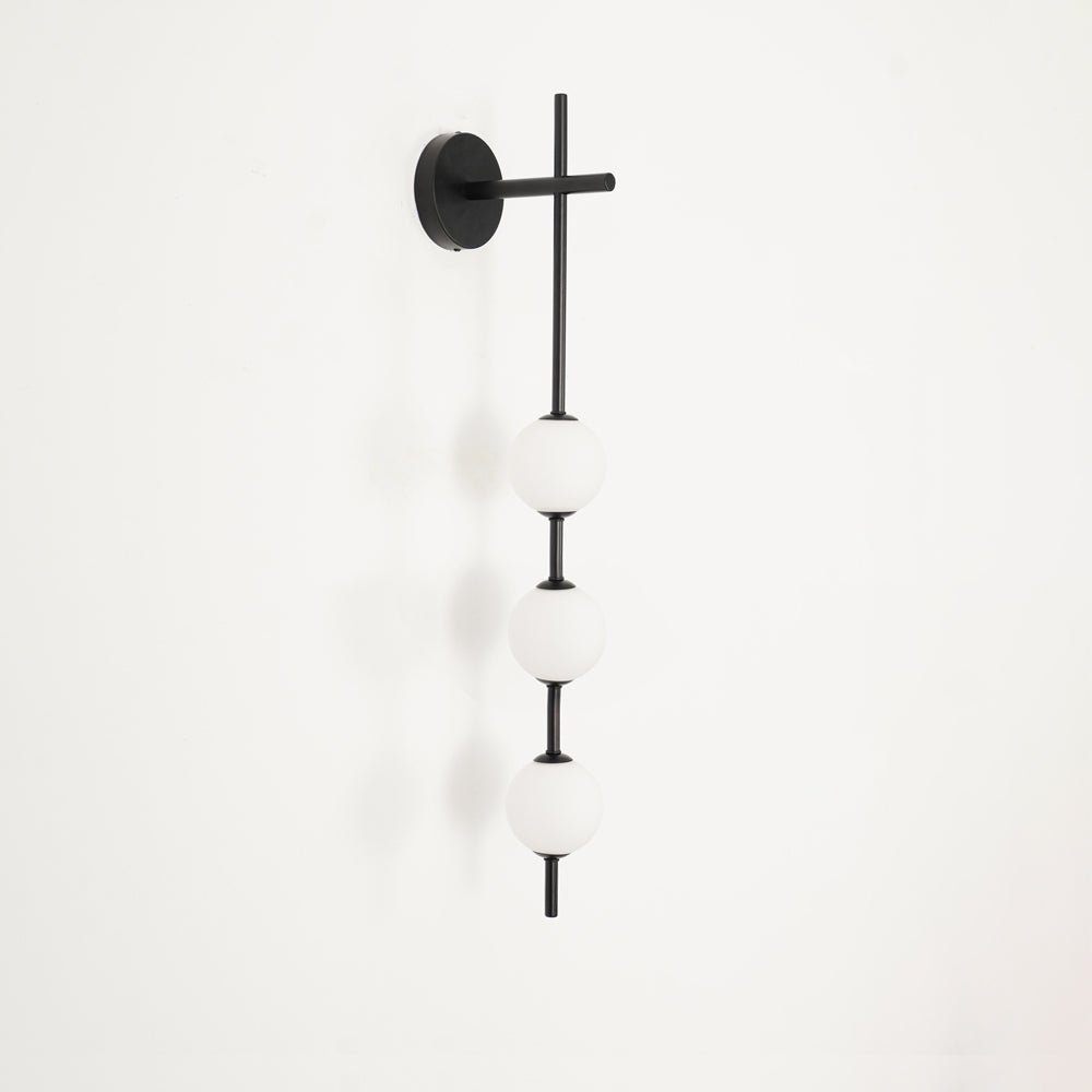 Miriiella vägglampa vertikal klotformad minimalistisk