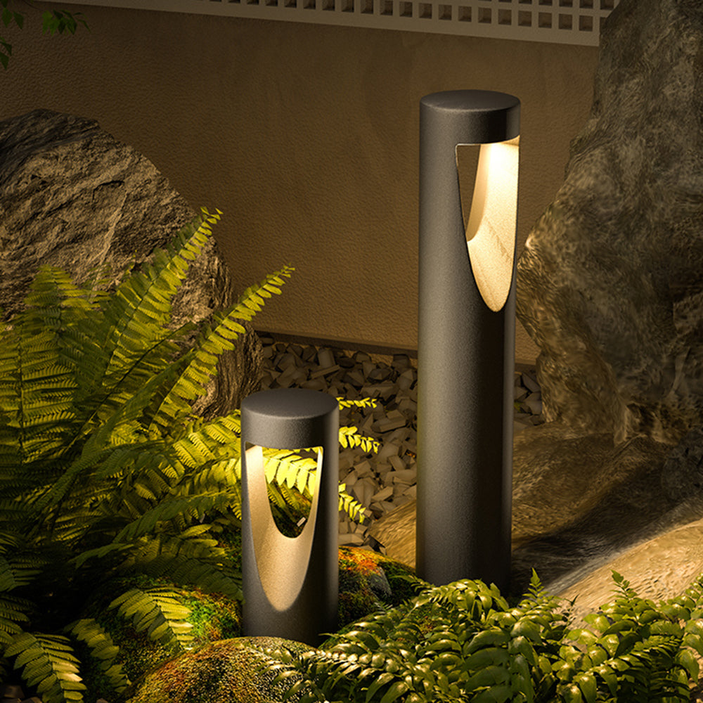 Ray moderne cylindrisk udendørs sti- og bedlampe i metal med hul design, sort