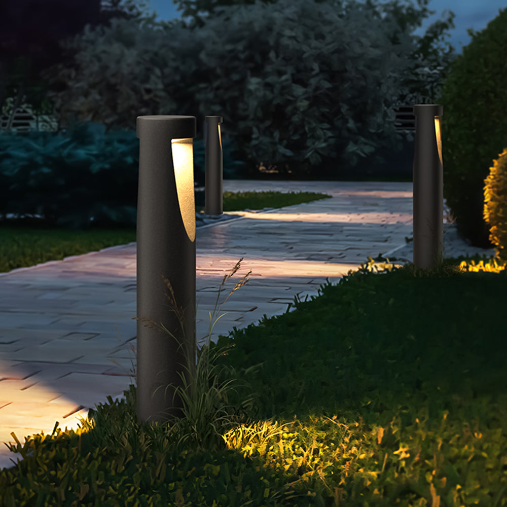 Ray moderne cylindrisk udendørs sti- og bedlampe i metal med hul design, sort