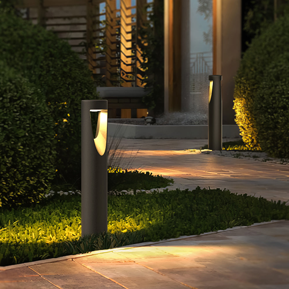 Ray moderne cylindrisk udendørs sti- og bedlampe i metal med hul design, sort