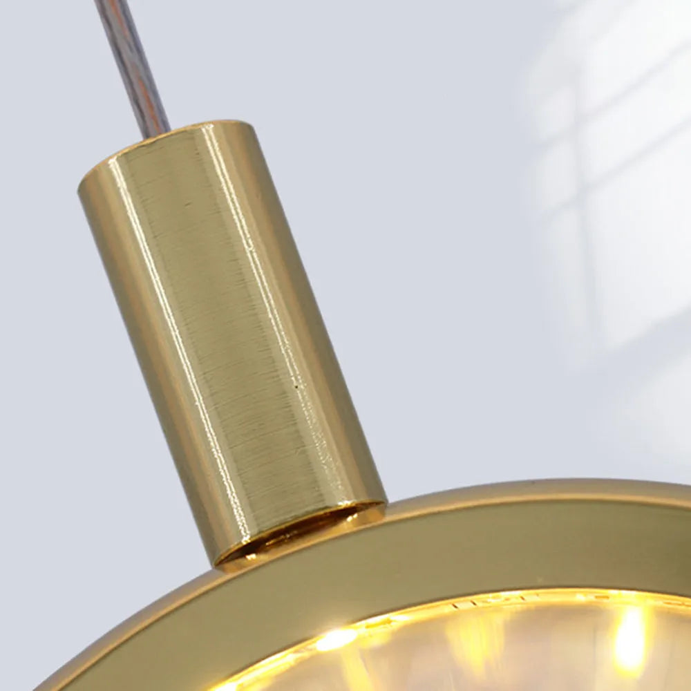 Kristy modern sfärisk pendellampa i metall, guld
