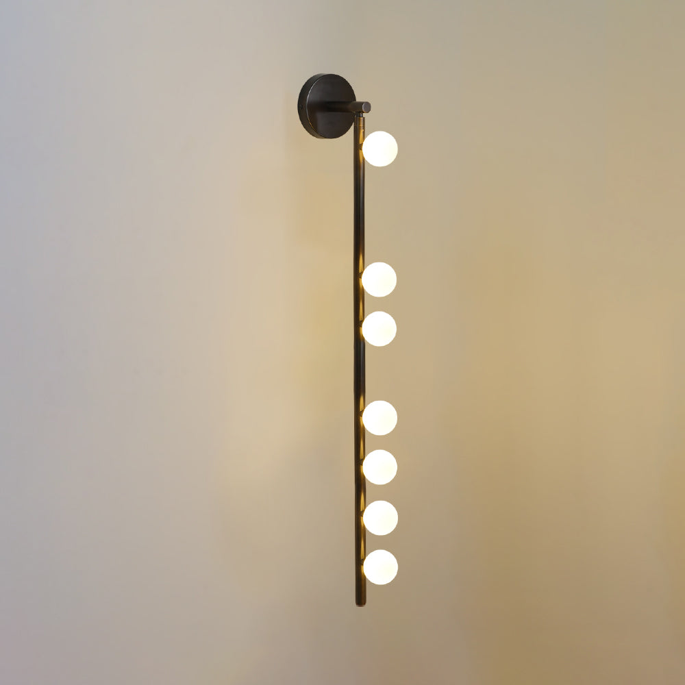 Rory moderne minimalistisk rørformet væglampe i messing og glas