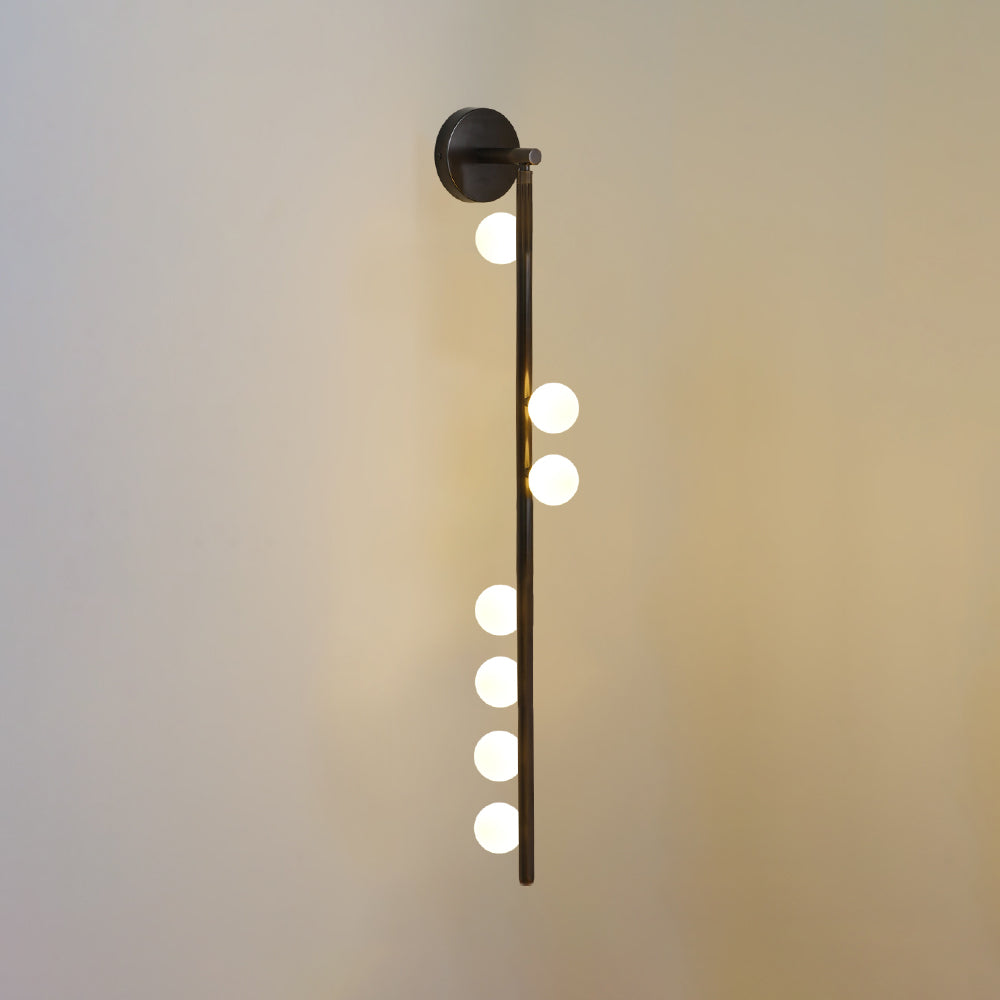 Rory moderne minimalistisk rørformet væglampe i messing og glas