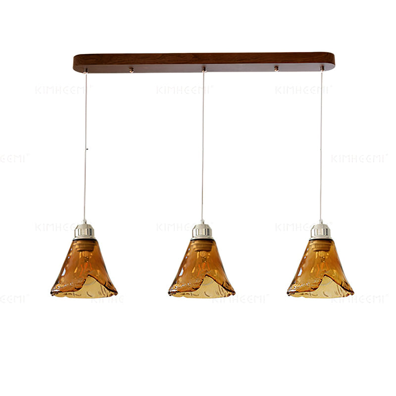 Pendellampe i ravfarvet glas