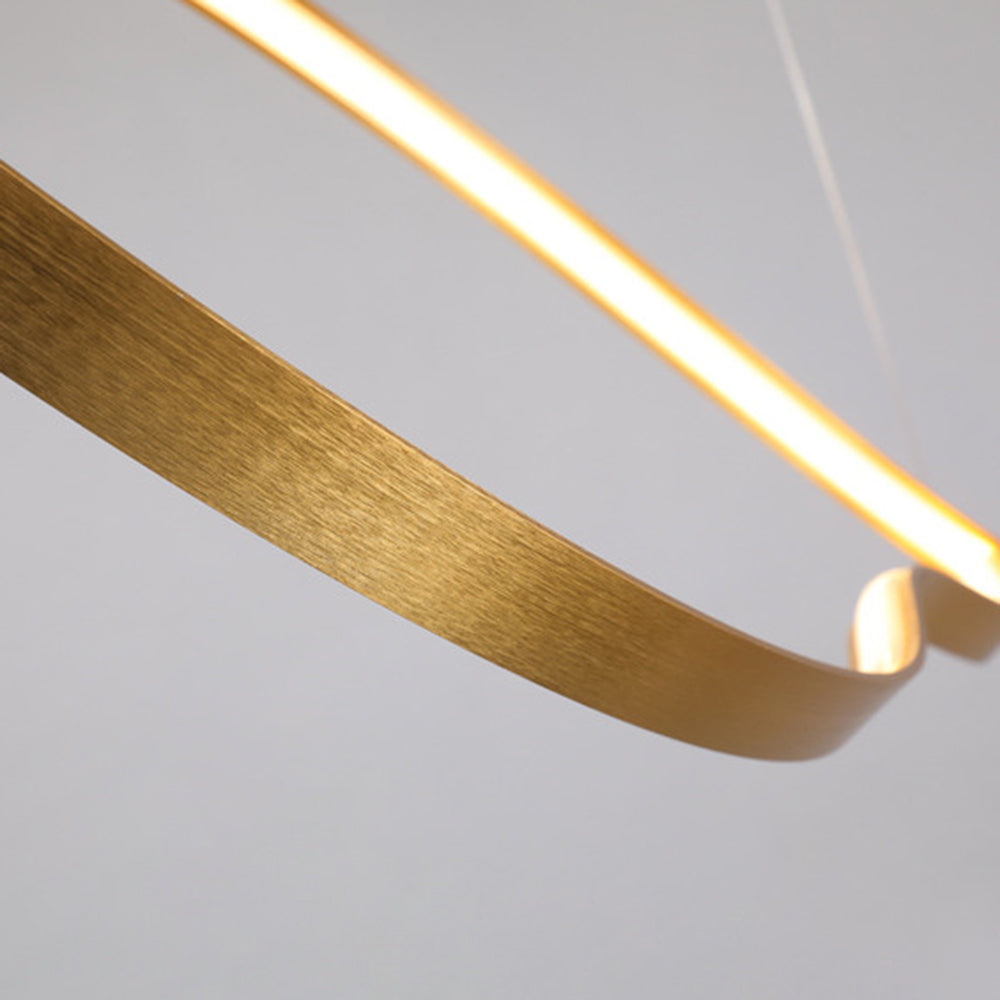 Arisha minimalistisk linjär LED-pendellampa i vågform med gyllene lövform