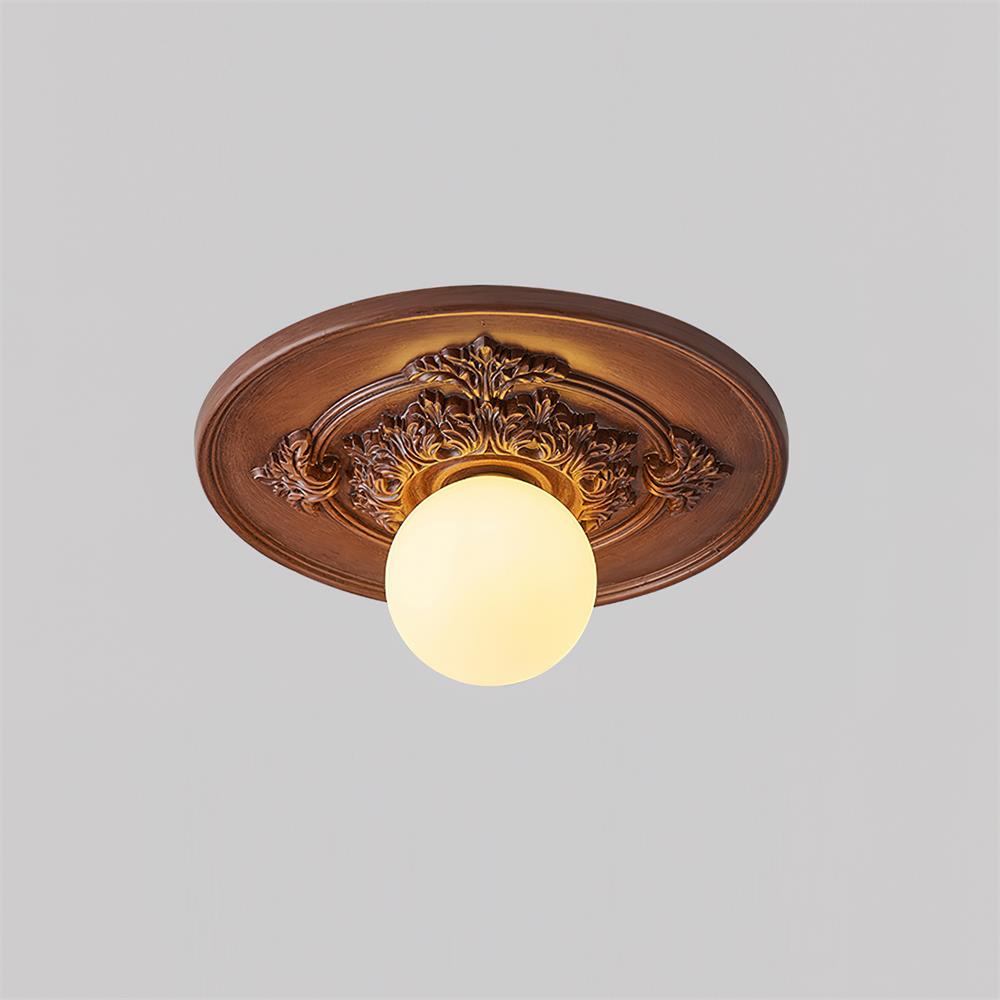 Elya vintage-taklampa med snidad design och globformad skärm