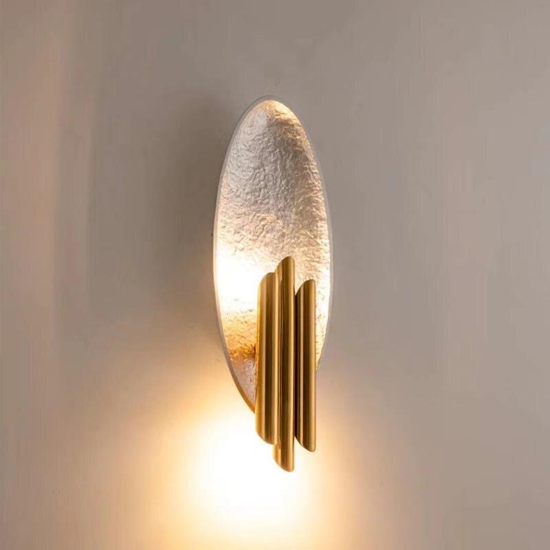 Aurerielle minimalistisk væglampe i guld og sort