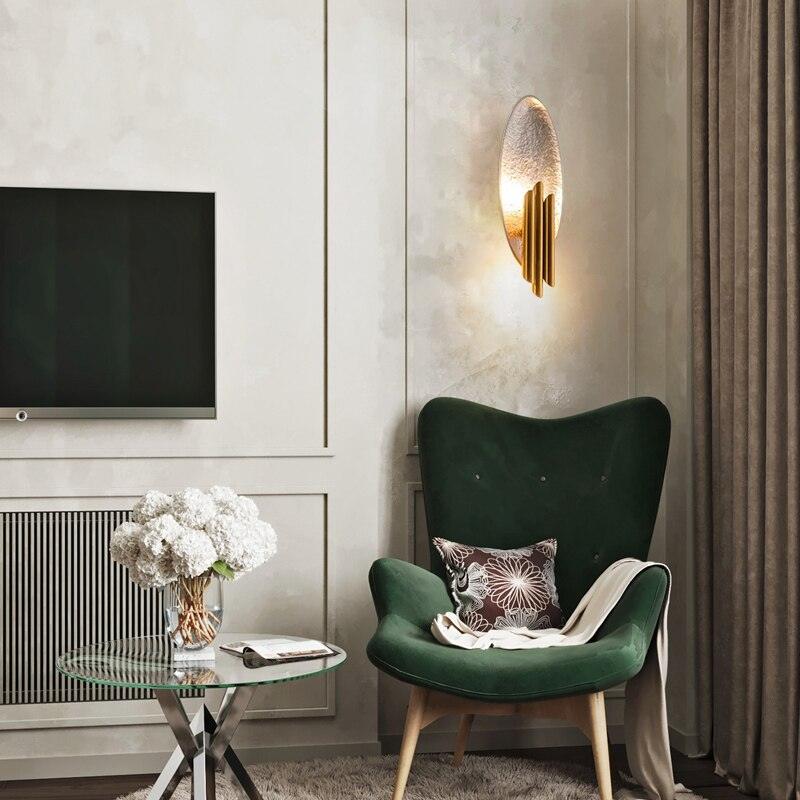 Aurerielle minimalistisk væglampe i guld og sort