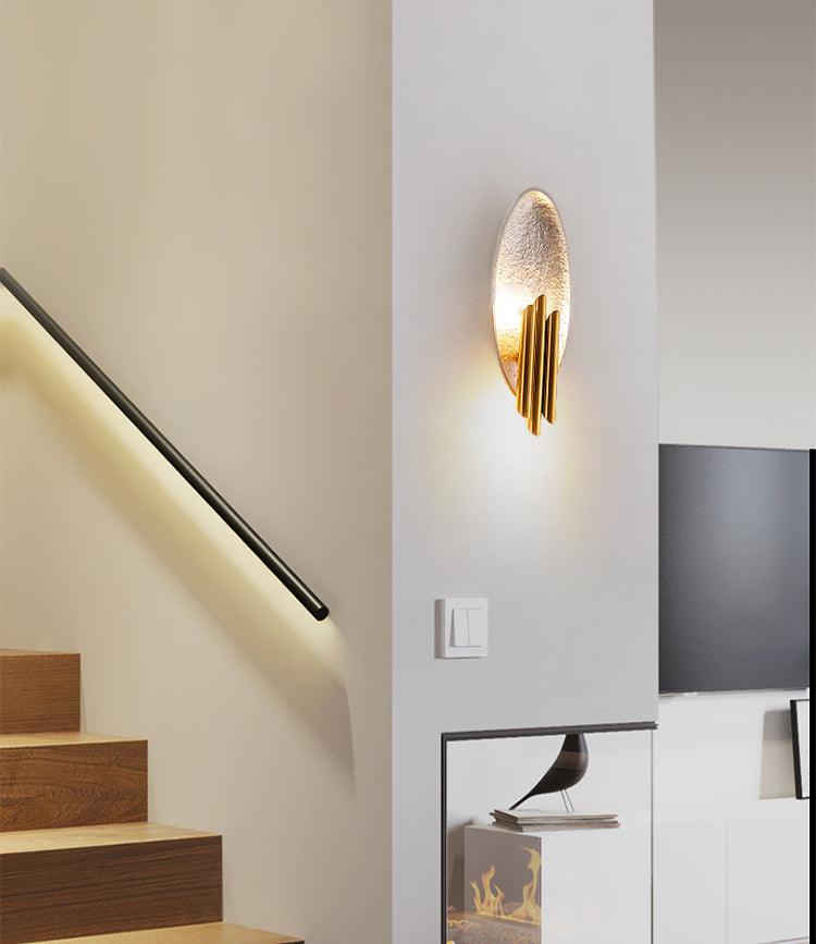 Aurerielle minimalistisk væglampe i guld og sort