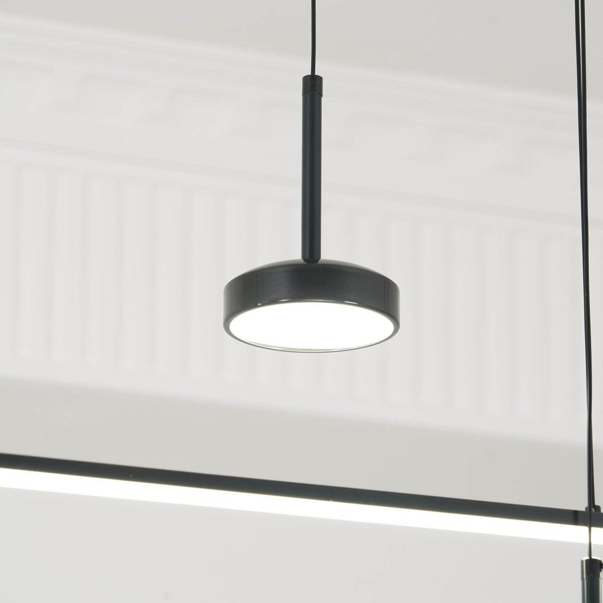 Tildas geometriske ringpendel minimalistisk