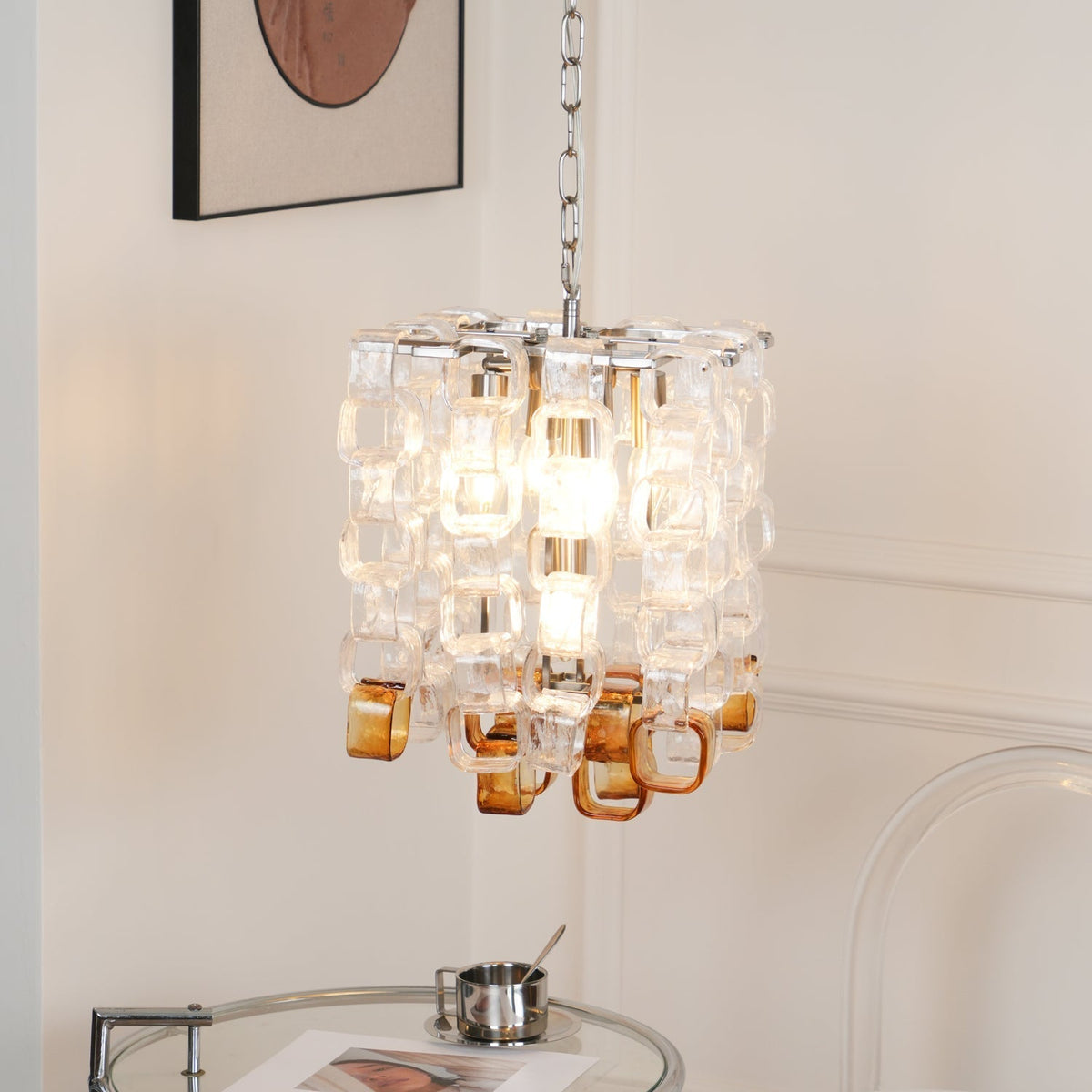 Orielis lysekrone i Murano-glas med sammenflettet geometrisk design