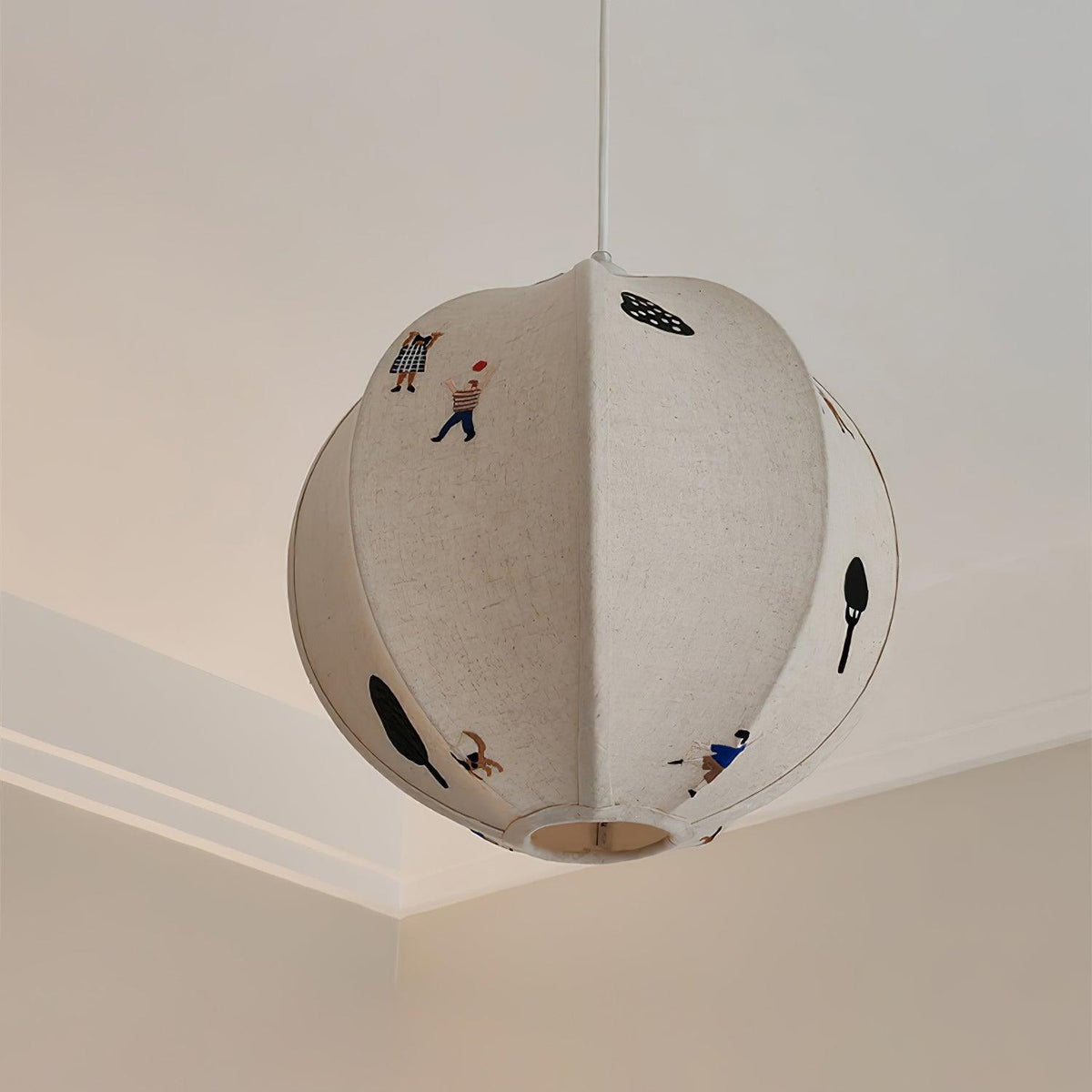 Elva pendellampa i papper med bollmotiv