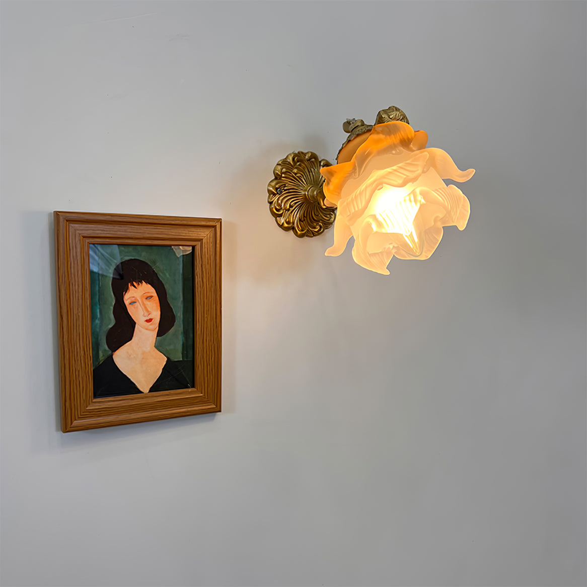 Arque rosafärgad vägglampa i glas