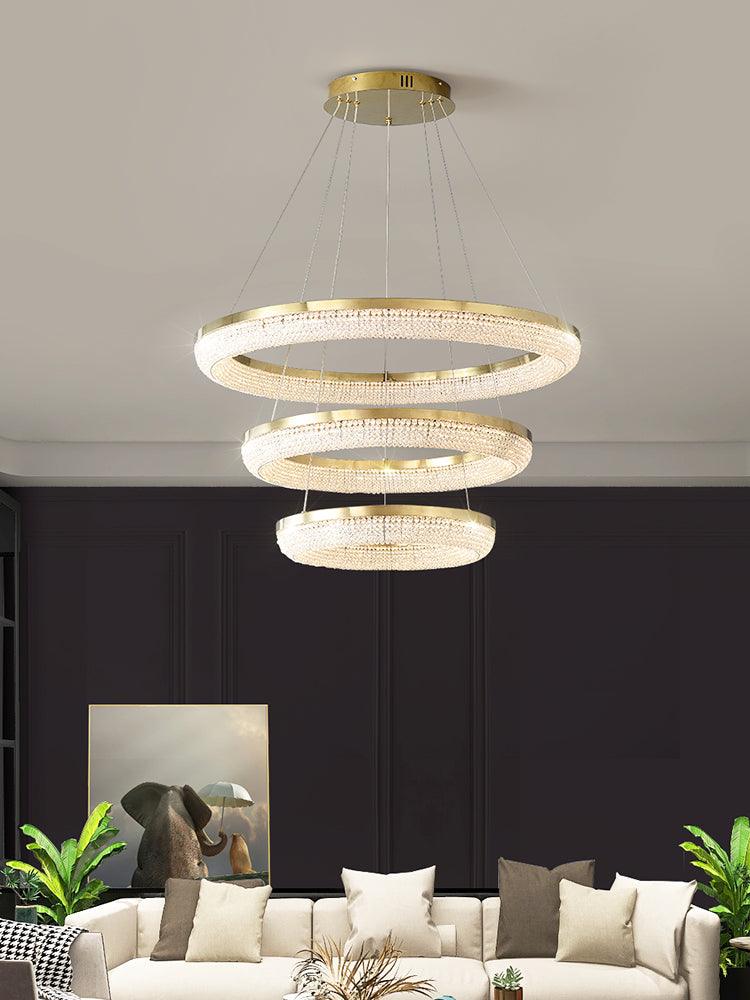 Cyrereon rund kristallampa i guld med LED