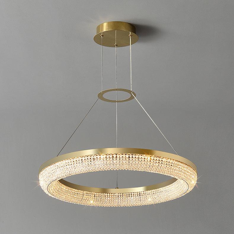 Cyrereon rund kristallampa i guld med LED