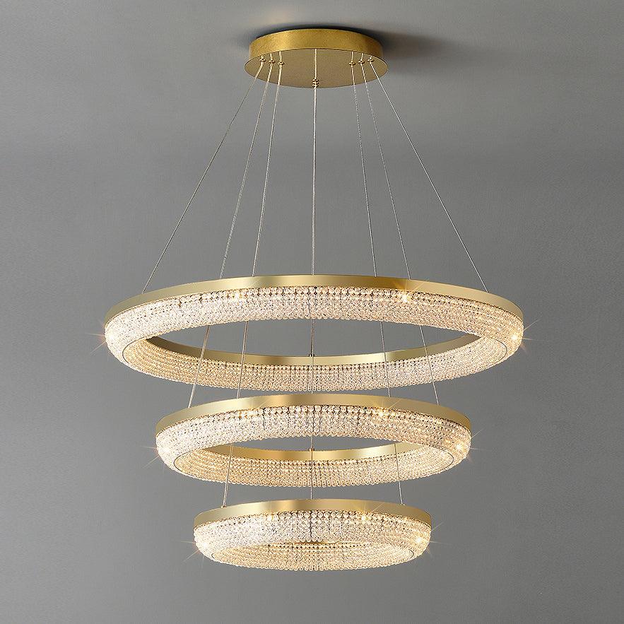 Cyrereon rund kristallampa i guld med LED
