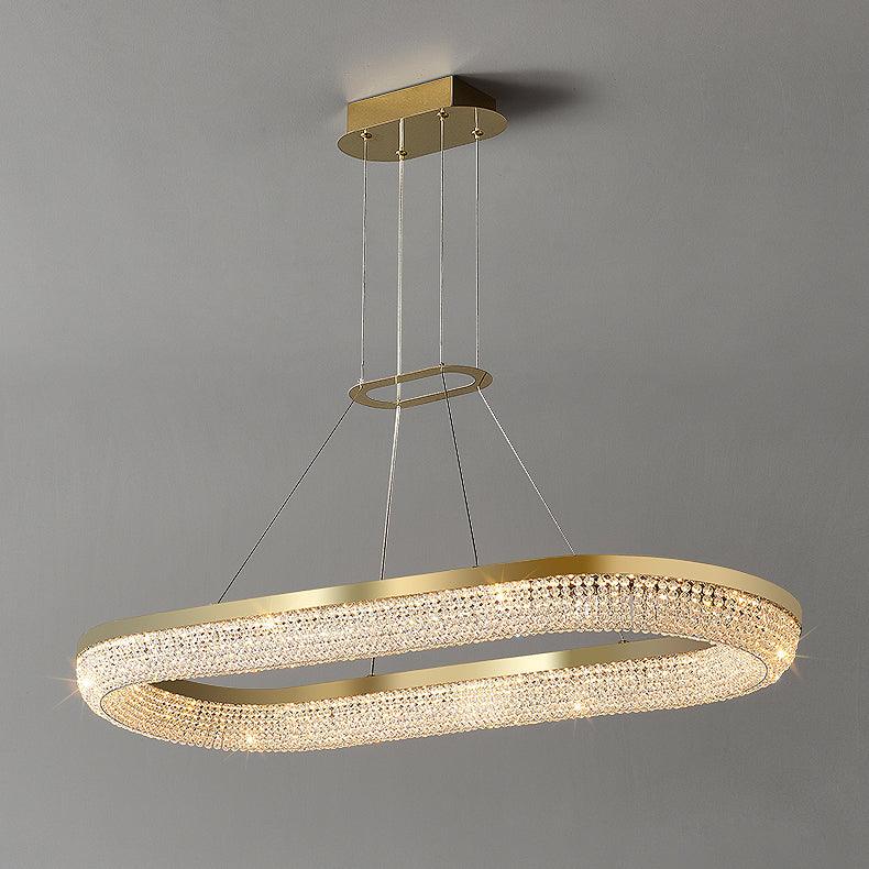 Cyrereon rund kristallampa i guld med LED