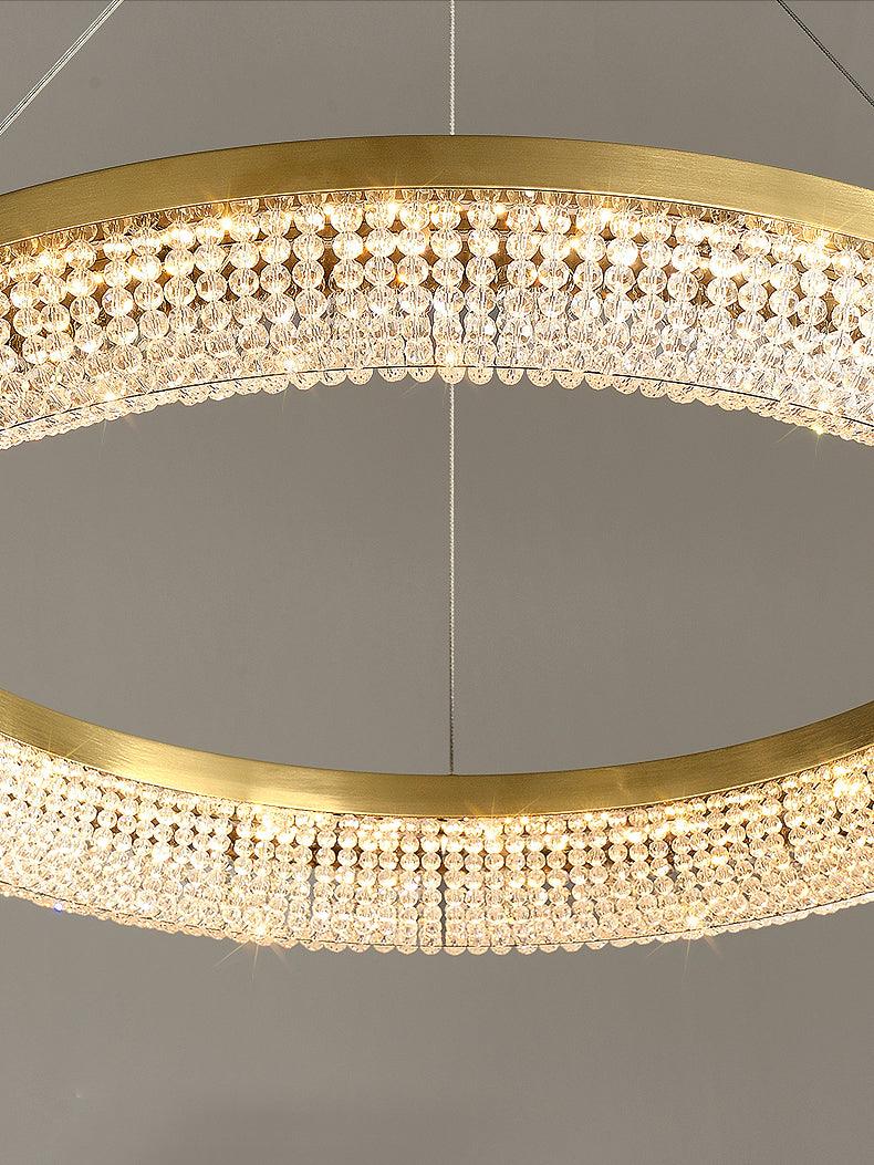 Cyrereon rund kristallampa i guld med LED