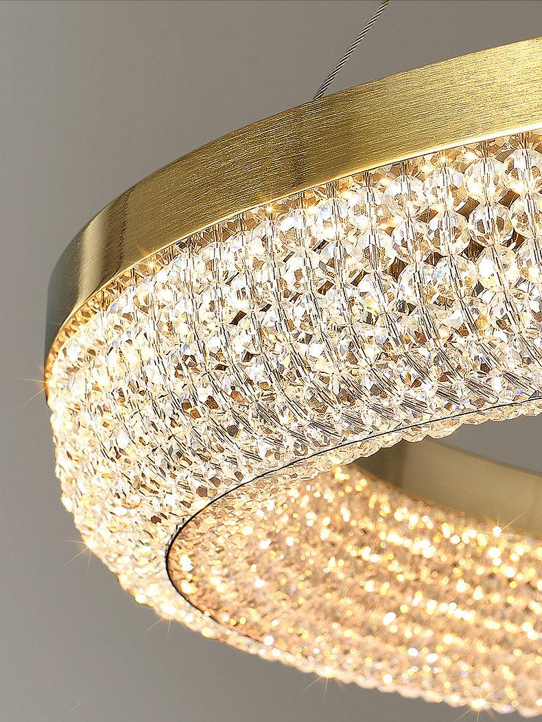 Cyrereon rund kristallampa i guld med LED