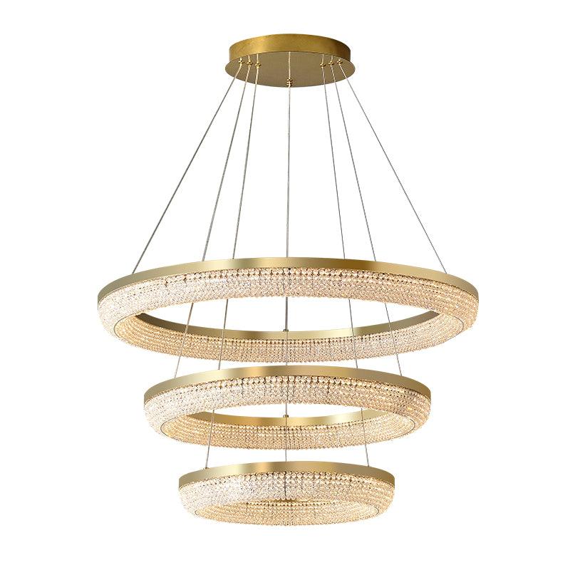 Cyrereon rund kristallampa i guld med LED