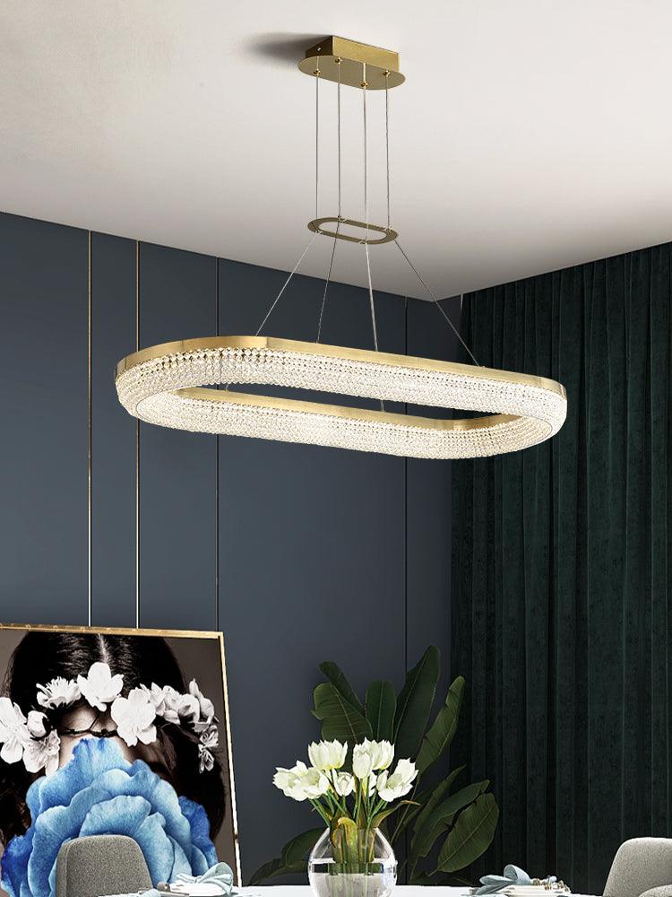 Cyrereon rund kristallampa i guld med LED