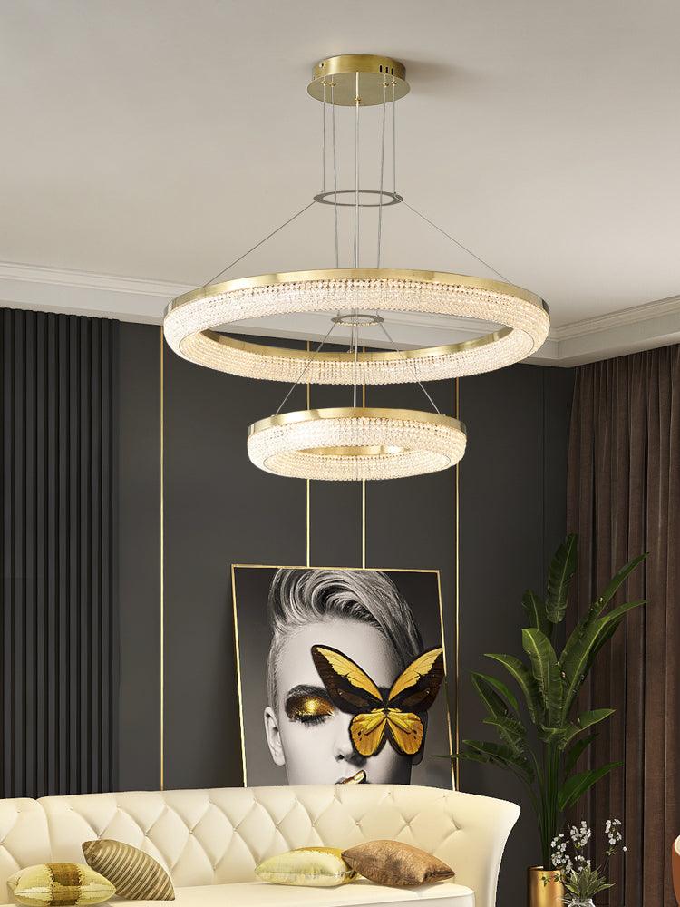 Cyrereon rund kristallampa i guld med LED