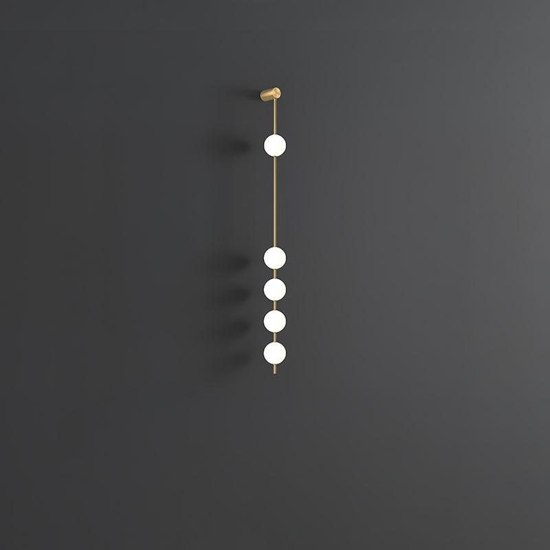 Luminária de parede Soloiella com bolas verticais em latão